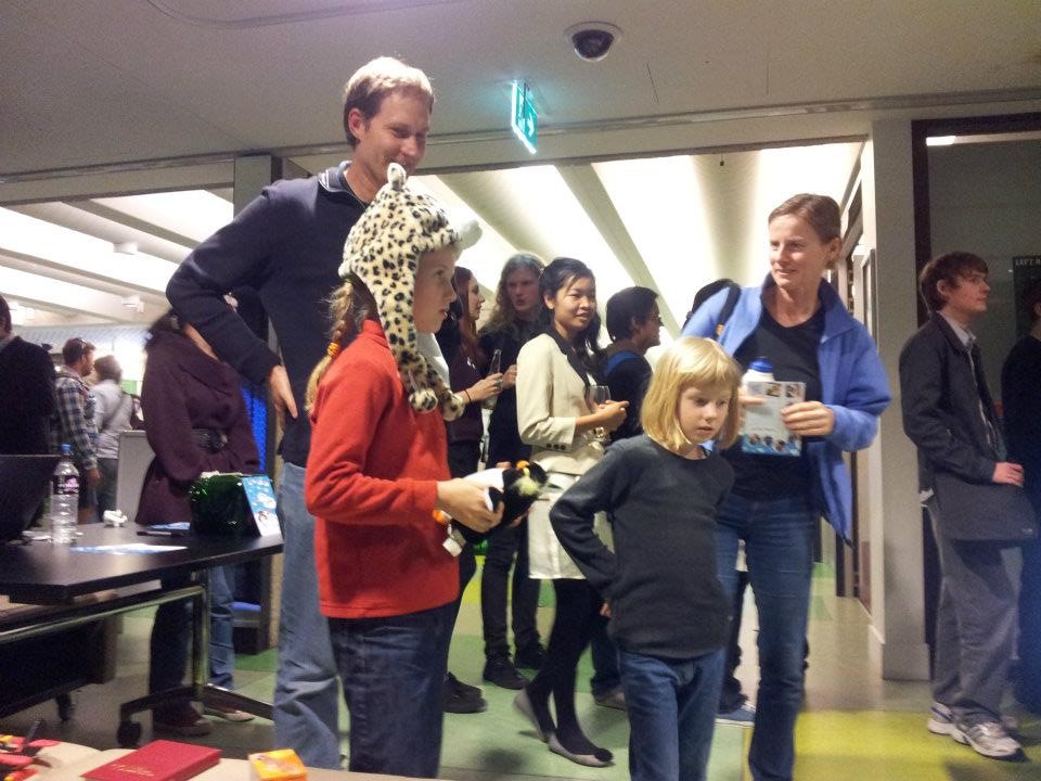 Kid with penguin in hand and Cheeta Headset on